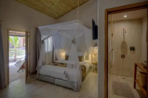 Boutique-hôtel Les Palétuviers : chambre et jardin